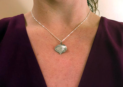 A girl wearing the Sterling Silver Birch Heart Leaf pendant on Sterling silver Necklace