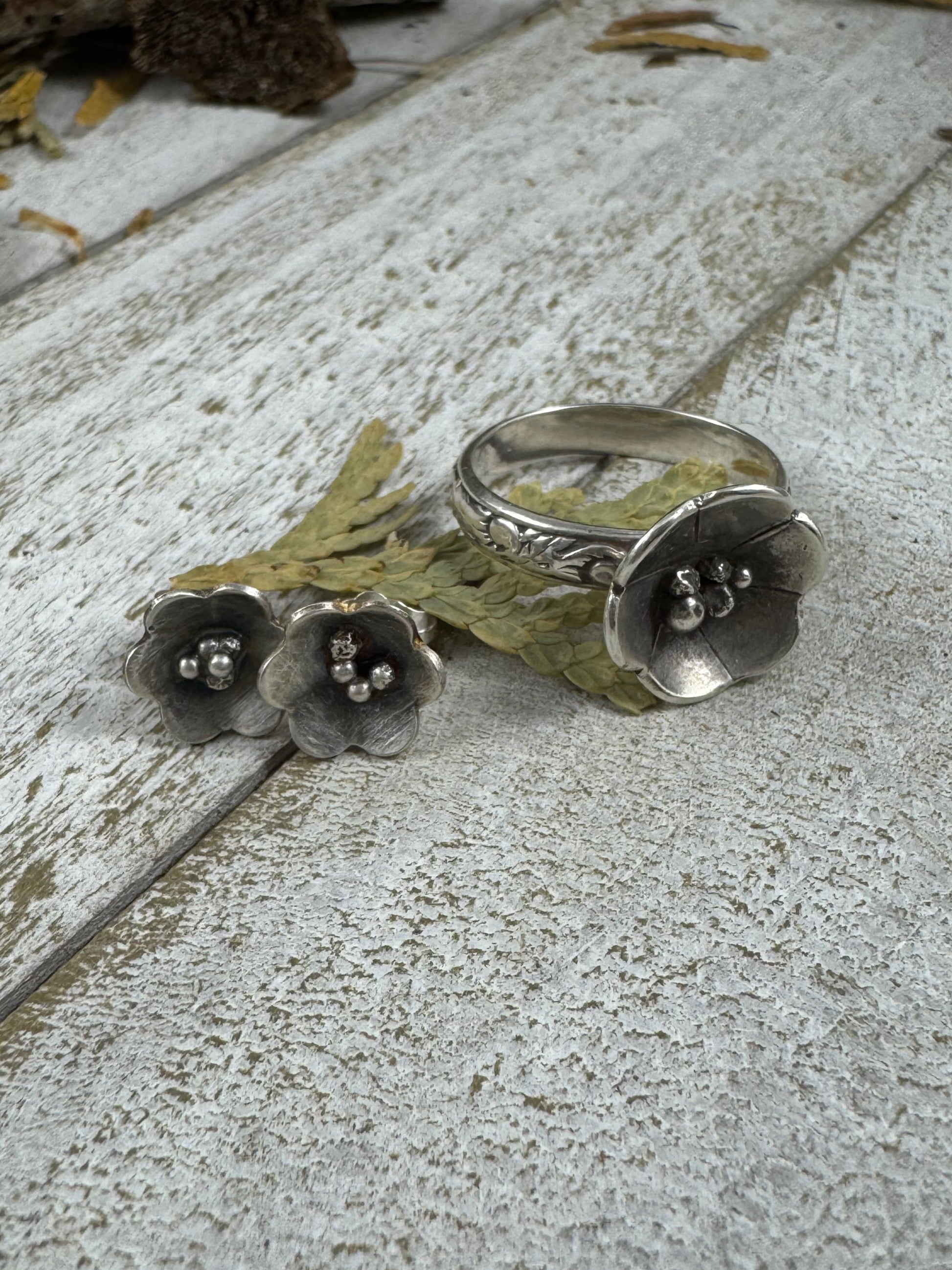 Sterling Silver Flower shaped stud earrings and matching ring by Rust and Leaf