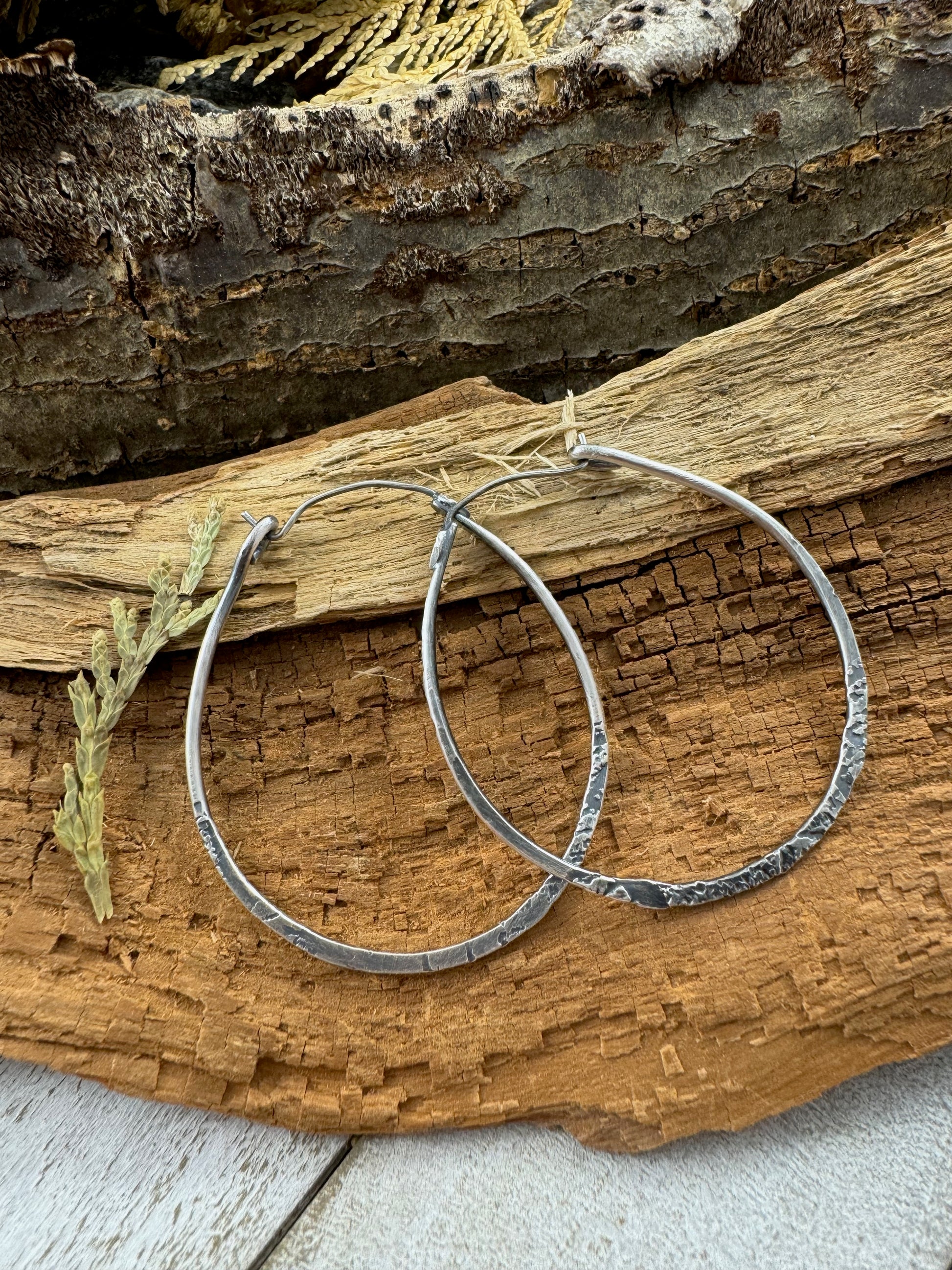 Sterling Silver Free Spirit Hoops with multi texture on wood display