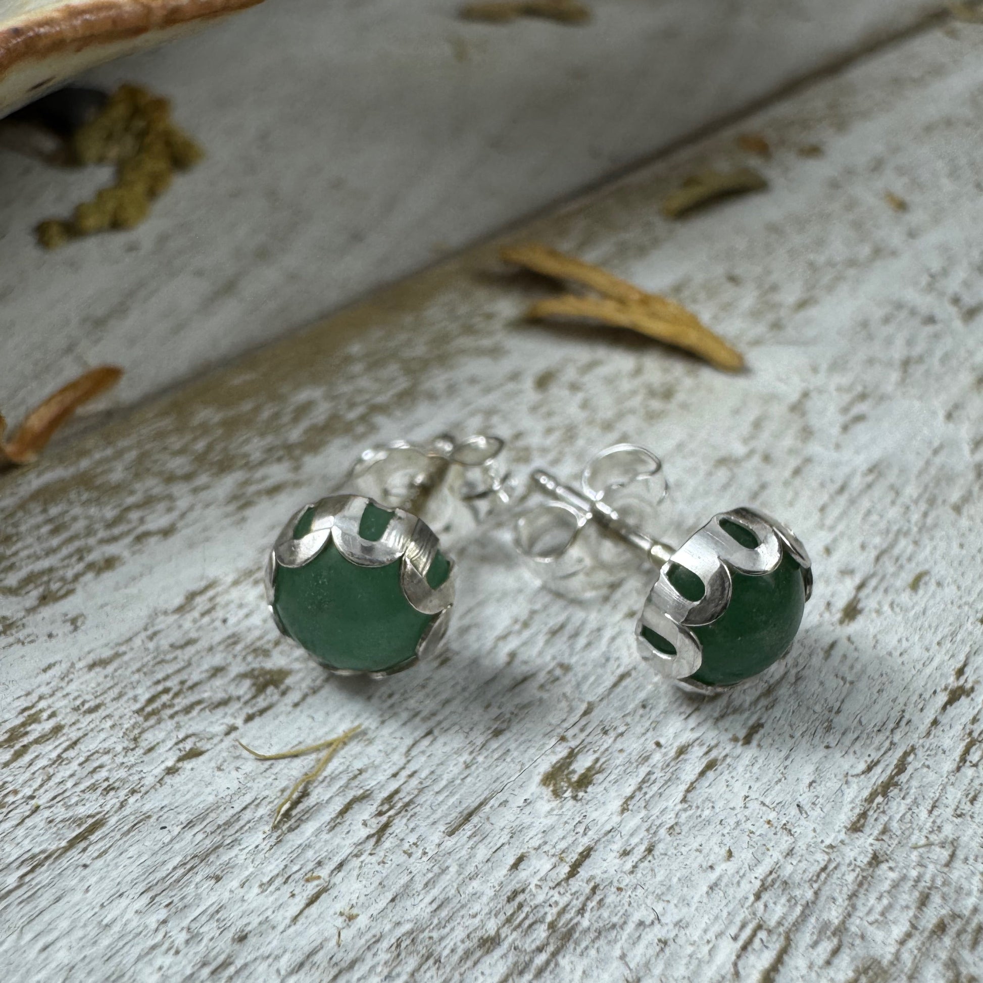 Handmade sterling silver green aventurine stud earrings with 6mm stones, shown in flower and smooth bezel styles from the Little Wilds collection - earthy, poetic jewelry for heart-centered growth