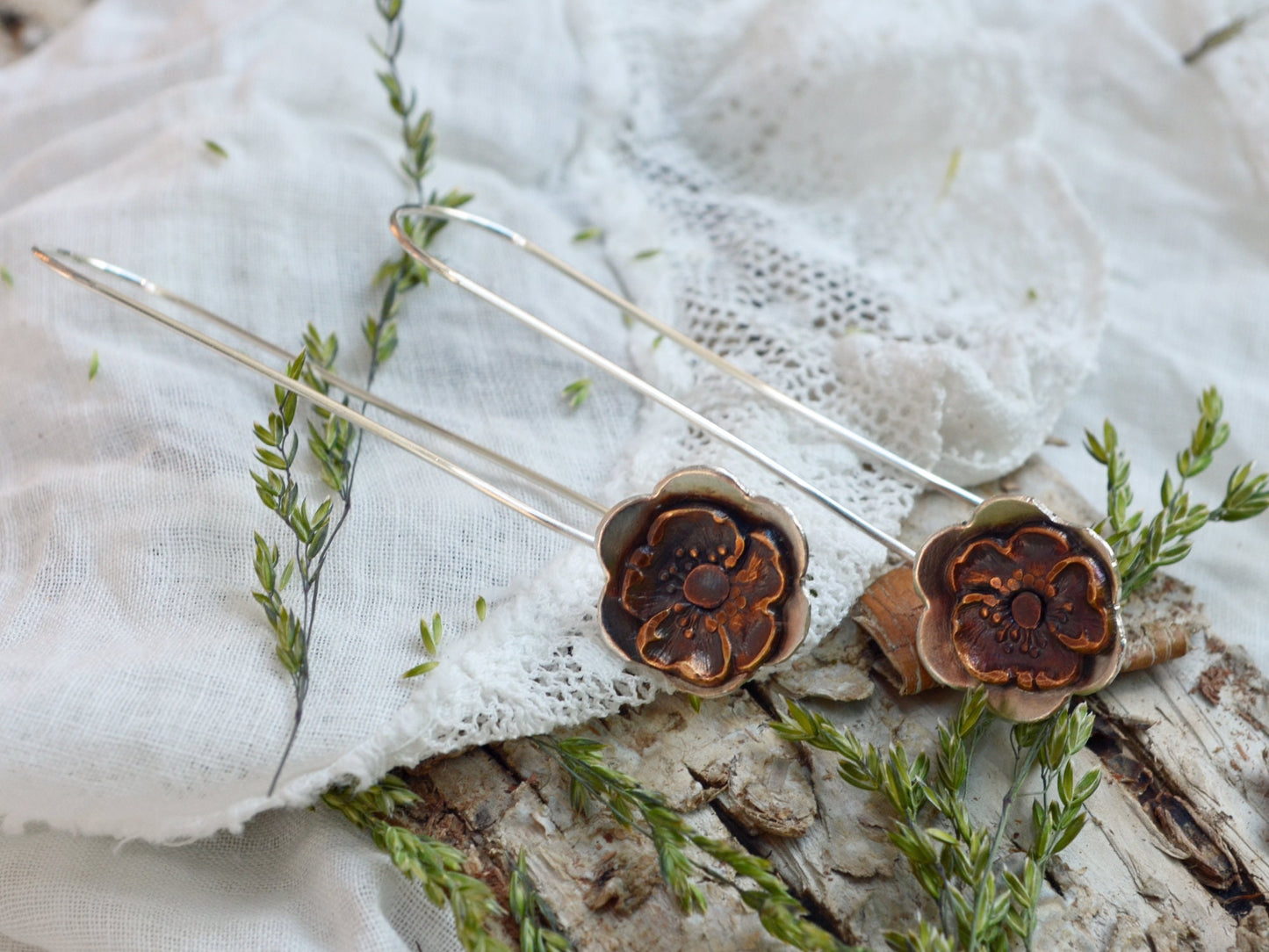 Gypsy Flower Earrings with Vintage Pansy lying on the side of a vintage doily