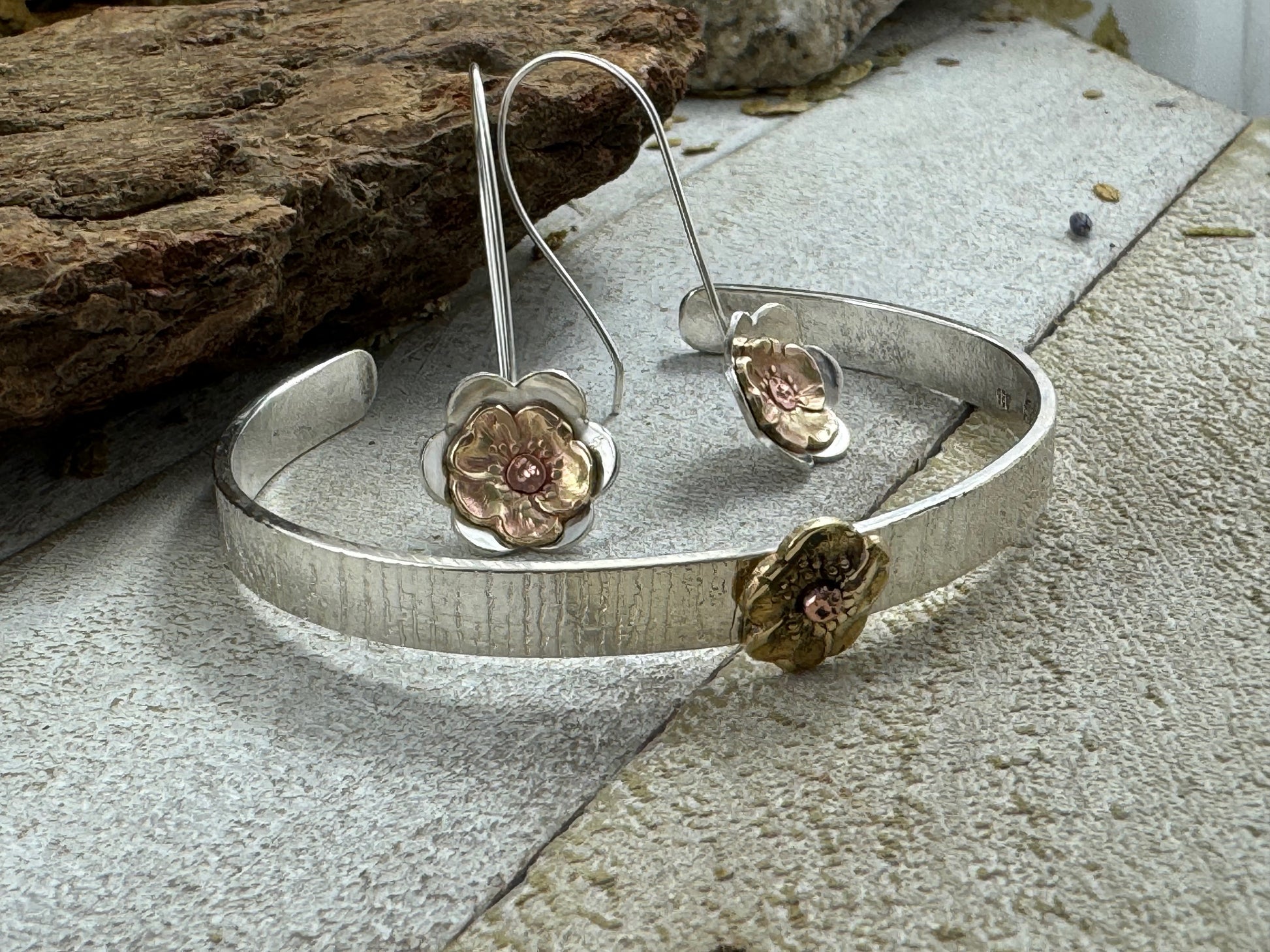 Sterling Silver flower dangle earrings with cold connection vintage repurposed brass pansy fabricated during the Art Nouveau period, with matching tree bark cuff