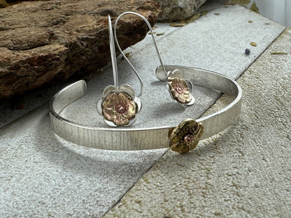 Sterling Silver flower dangle earrings with cold connection vintage repurposed brass pansy fabricated during the Art Nouveau period, with matching tree bark cuff