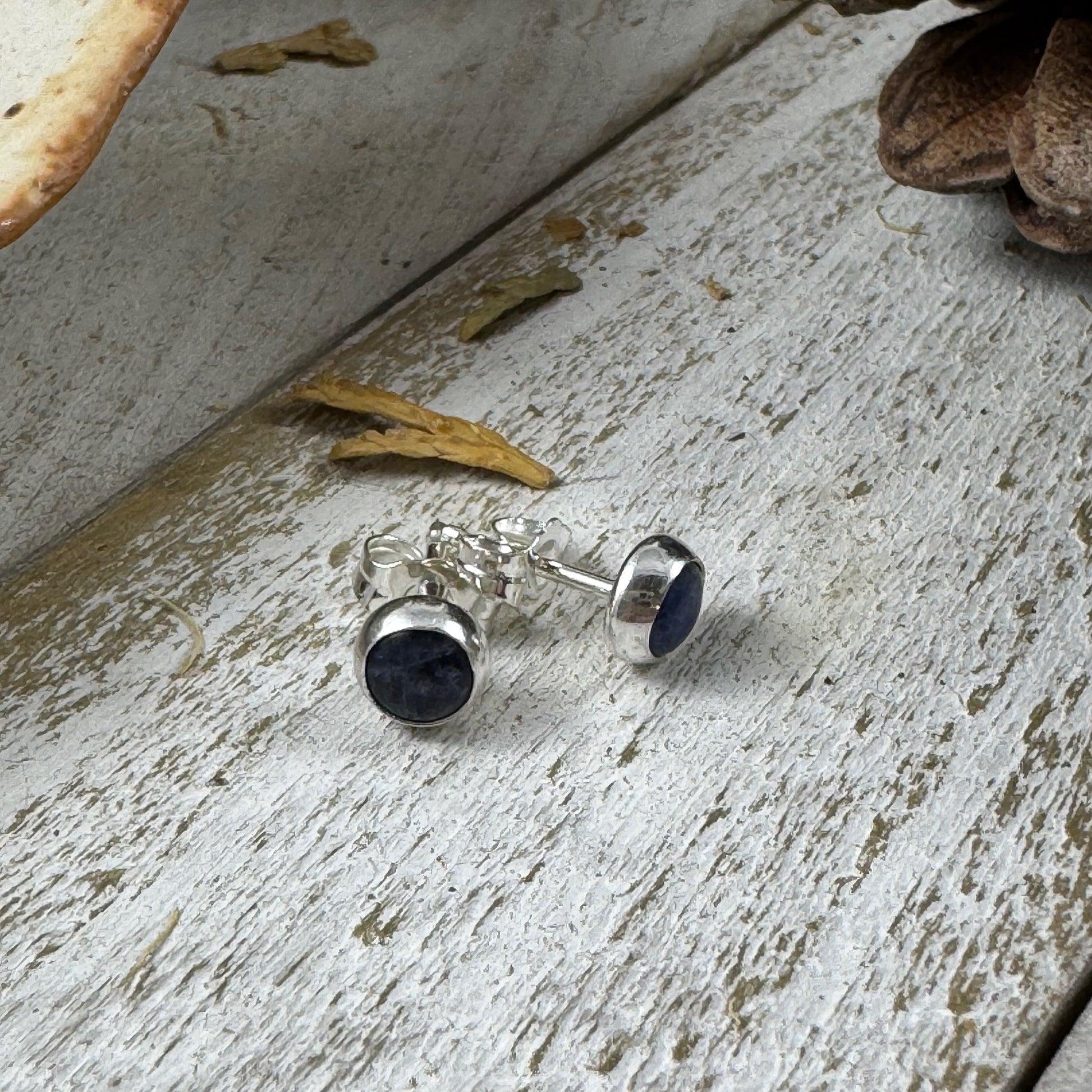 Fine Silver bezel stud earring in Sodalite on white rustic wood background