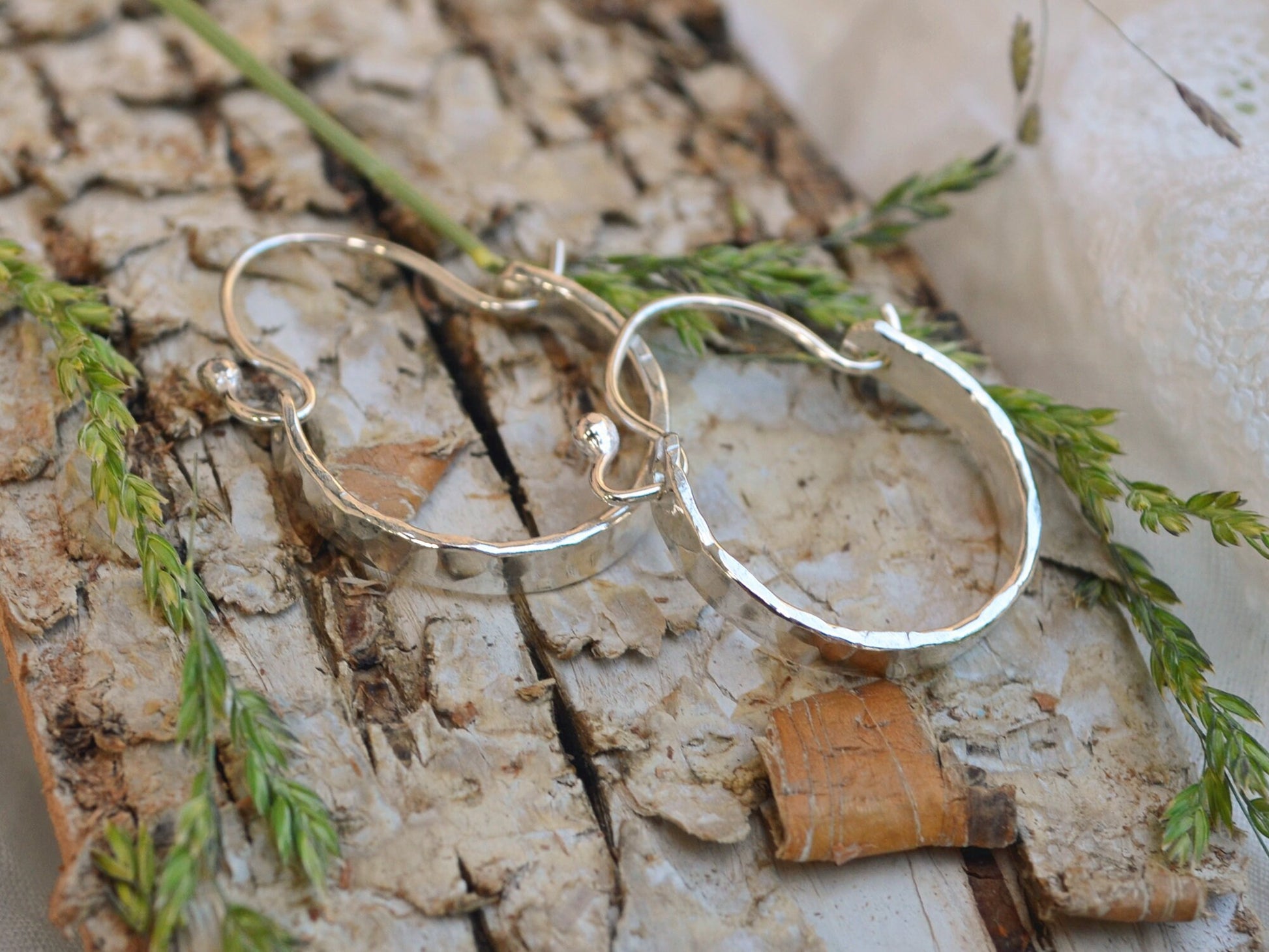 Sterling silver minimalist Hammered Hoops on bark and dried flowers