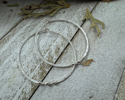 Medium Sterling Silver Hammered hoops with three silver ball accents on each by Rust and Leaf