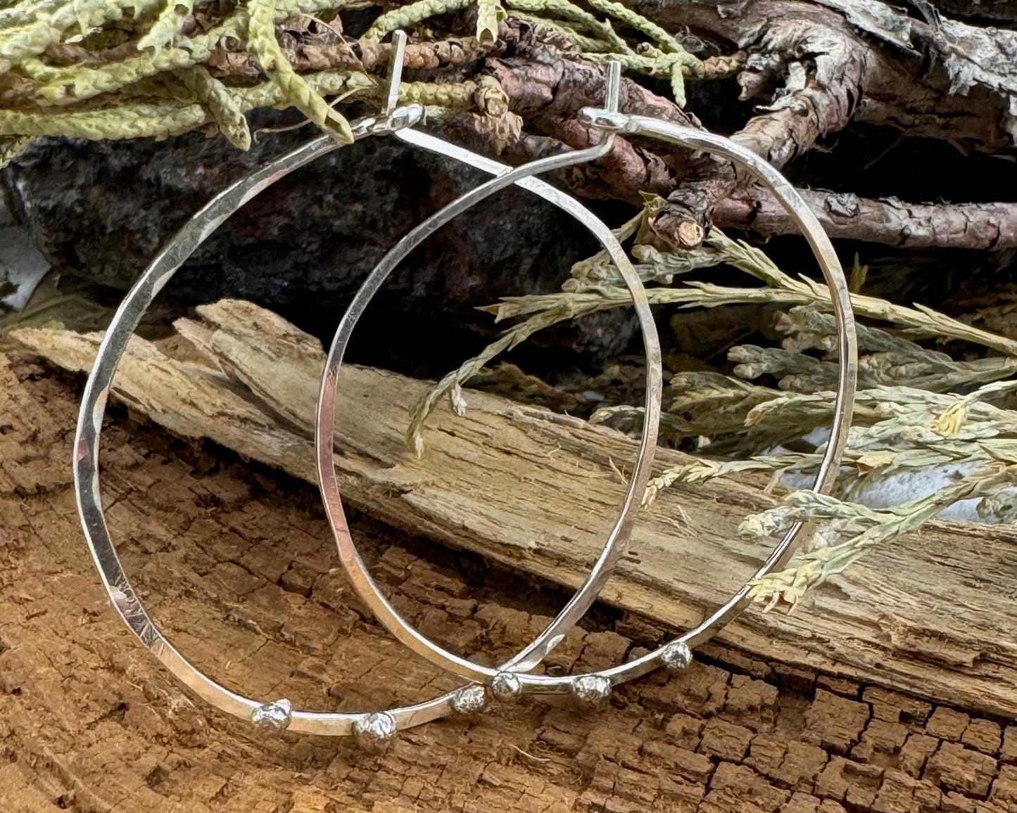 Medium Sterling Silver Hammered hoops with three silver ball accents on each by Rust and Leaf