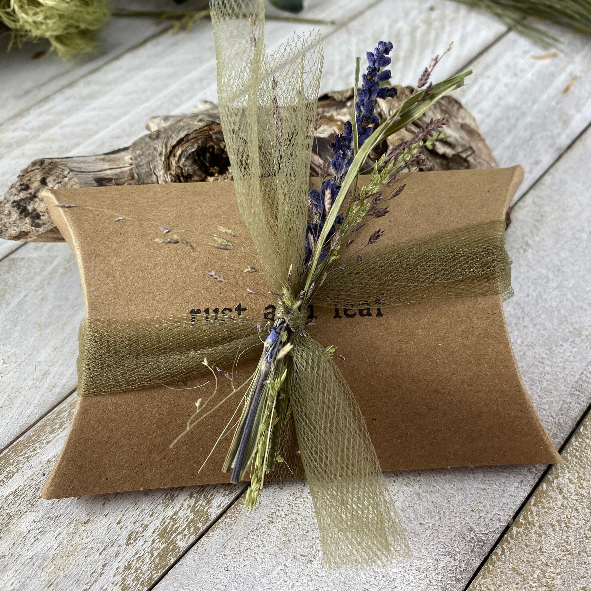 Rust and Leaf Branded Kraft Pillow Box packaging example with dried flowers and tulle